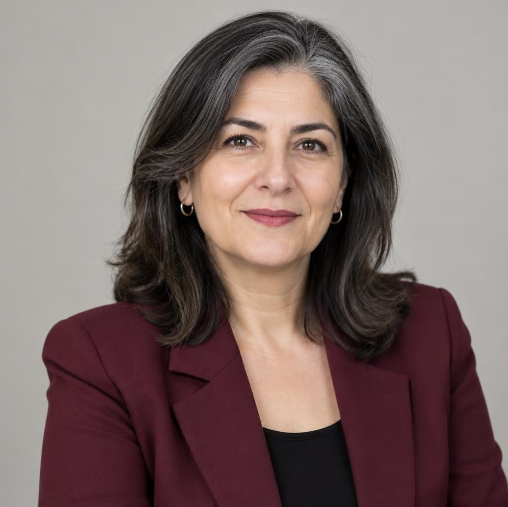 Portrait of a Turkish woman in her 50s with gray streaked hair